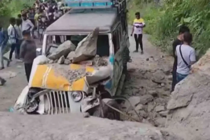 The vehicle damaged by boulders on NH10 at Bhasua, near the Coronation Bridge, on Monday. The Telegraph