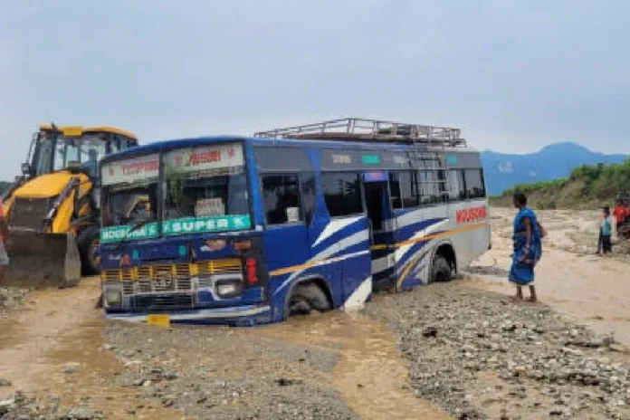 The private bus carrying 42 persons, including 20 students, stuck in the Bangri river on Wednesday morning. The picture was take after the river water had receded. Picture by Anirban choudhury/The Telegraph