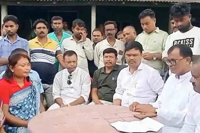 Abhhijt De Bhowmik, the Cooch Behar district Trinamool head (right) speaks with Binama Barman (left), the pradhan of Hajrahat-II panchayat in Mathabhanga on Wednesday. Picture by Main Uddin Chisti/The Telegraph