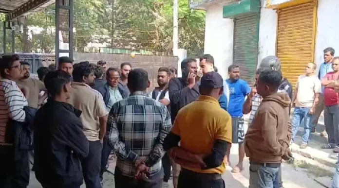 Relatives wait outside Siliguri District Hospital as the body is brought in for post-mortem.
