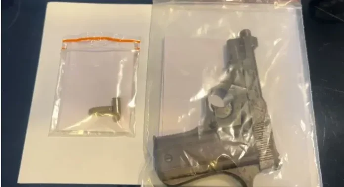 A firearm and two rounds of ammunition seized by Matigara police during a late-night operation, kept as evidence following the arrest of a youth. Saturday, 13 December 2025.