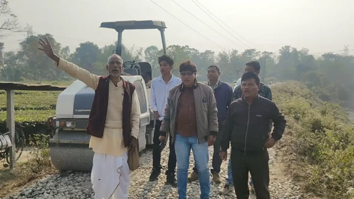 Local residents stage a protest at the construction site in Rajganj, halting road work over allegations that the proposed road width is inadequate.
