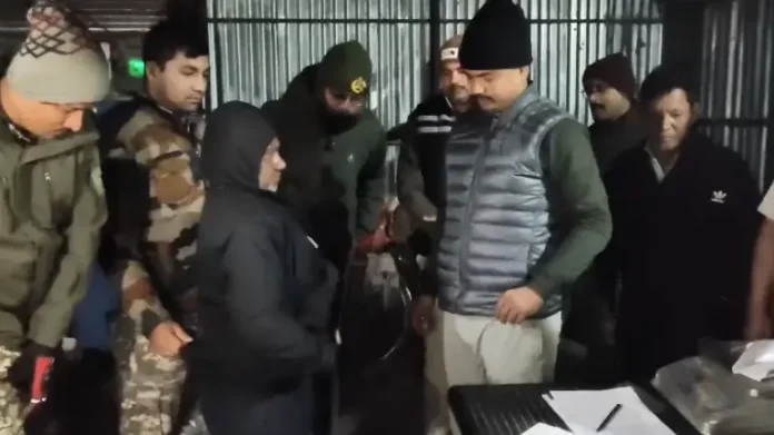 Kharibari police display seized brown sugar and banned cough syrup recovered during a raid in Gandogol Jote, leading to the arrest of an accused drug peddler.