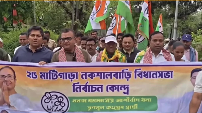 TMC candidate Shankar Malakar joins tea garden workers during a campaign procession in Naxalbari, highlighting labour issues ahead of the upcoming polls. Sunday, 22 March 2026.