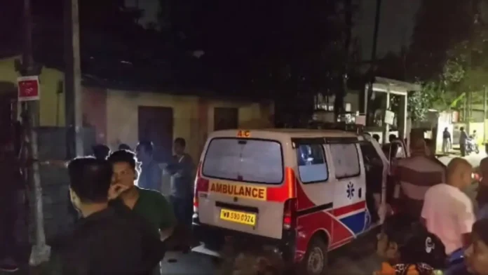 Ambulance arrives at the spot as locals gather near the electric pole in Siliguri’s Shanti Nagar following the electrocution incident. Saturday, 28 March 2026.