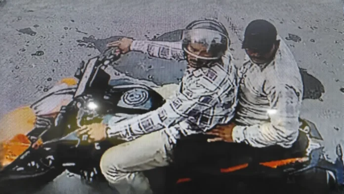 CCTV grab shows two alleged miscreants on a motorcycle moments before fleeing after snatching a woman’s gold chain in Siliguri’s Subhash Pally area. Monday, 20 April 2026.