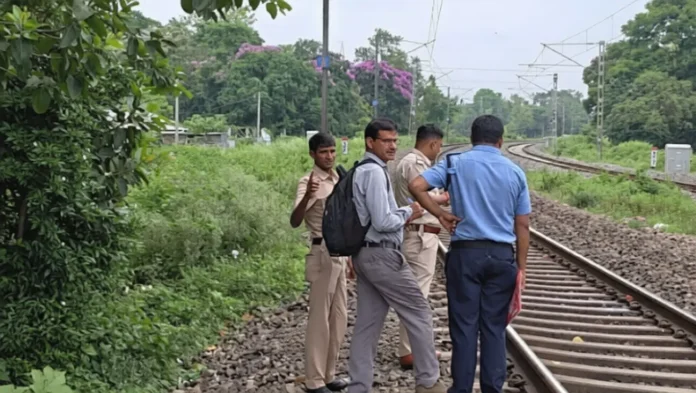 Railway police at the spot near Sahudangi Chinnamasta Kali Temple after a man was fatally hit by a train on Saturday morning. Saturday, 23 May 2026.