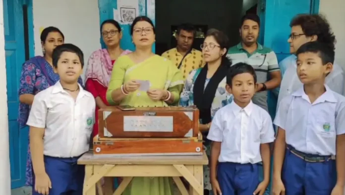 Students of Sonaulla Primary School in Jalpaiguri participate in the morning assembly and sing ‘Vande Mataram’ as classes resume after the summer vacation on Monday. 01 June 2026.